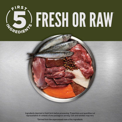 Platter with raw meats and fish on a metallic surface, branded 'First 5 Ingredients'.